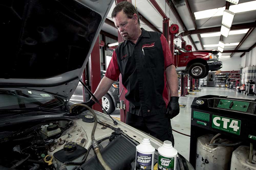 a man standing next to a car